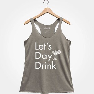 May include: A gray tank top with the text "Let's Day Drink" and a white illustration of a cocktail glass with a lime wedge.