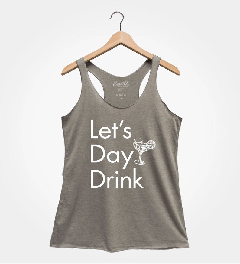 May include: A gray tank top with the text "Let's Day Drink" and a white illustration of a cocktail glass with a lime wedge.