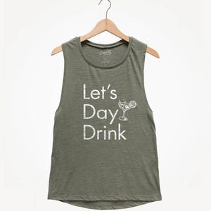 May include: A green sleeveless tank top with the text "Let's Day Drink" and a white illustration of a cocktail glass with a lime wedge.