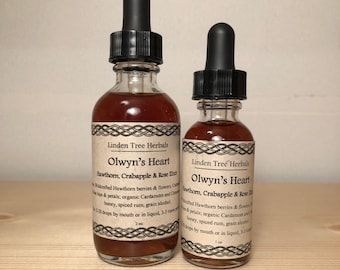 May include: Two glass bottles with dropper tops filled with a dark red liquid. The bottles are labeled "Olwyn's Heart Hawthorn, Crabapple & Rose Elixir" and are made by Linden Tree Herbals. The larger bottle is 2 oz and the smaller bottle is 1 oz.