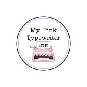 May include: A circular logo with a pink typewriter illustration. The text "My Pink Typewriter Ink" is displayed in black, with the word "Ink" on a paper in the typewriter. The logo is framed by a navy blue and pink circle.