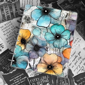 May include: A watercolour painting of flowers in shades of blue, yellow, and orange. The flowers are painted on a white background and are surrounded by black ink lines. The painting is framed by a black border.