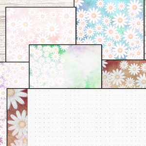 Puede incluir: Un paquete de papel digital con cinco diseños diferentes con margaritas blancas sobre una variedad de fondos, incluyendo rosa, azul, verde y marrón.