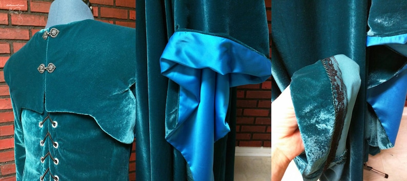 May include: Teal velvet cloak with a contrasting bright blue satin lining. The cloak features a high collar with decorative clasps and a laced back. The sleeves have a flared design with a satin cuff and black lace trim. A medieval-inspired garment.