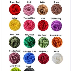 May include: A colour swatch chart displaying a range of yarn colours. The chart includes swatches of Cherry Red, Pink, Latte, Brown, Yellow, Tropical Pink, Red, Mixed Berry, Dark Olive, Jelly Bean, Mid Green, Desert Graze, Scarlet Rose, Cerulean Blue, Burgundy, Ivory, Lime Green, and Black.