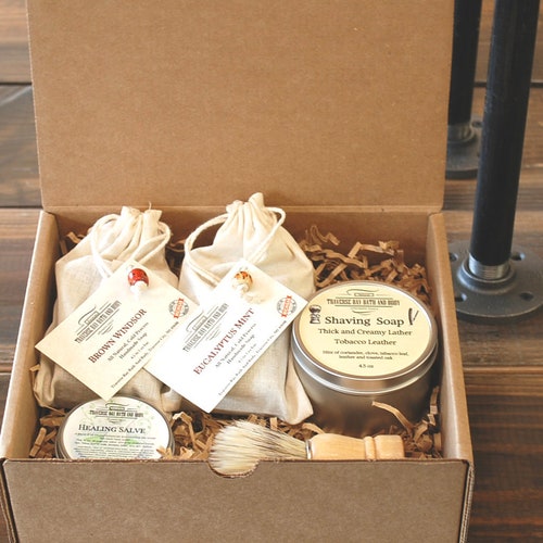 Shaving Kit Gift Box, 2 Bars cold process soap, Shaving soap, shaving brush, and a healing salve just in case.  A great gift.