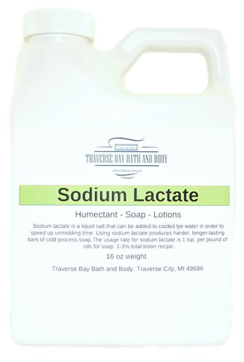 May include: A white plastic bottle with a green label that reads "Sodium Lactate" and describes it as a humectant, soap, and lotion ingredient. The label also includes the brand name "Traverse Bay Bath and Body" and the text "16 oz weight".