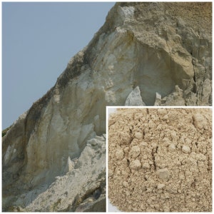 May include: Close-up of a light brown powder, likely a type of clay or earth, with a rough texture. The powder is shown next to a cliff face with layers of white and brown rock.
