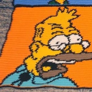 Op de afbeelding: Een gehaakt vierkant met een geel cartoonfiguur met een blauw shirt en een oranje achtergrond. Het personage heeft een verontruste uitdrukking met grote ogen en een open mond.
