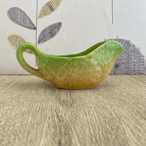 Carlton Ware sauce jug in yellow and green cabbage leaf style