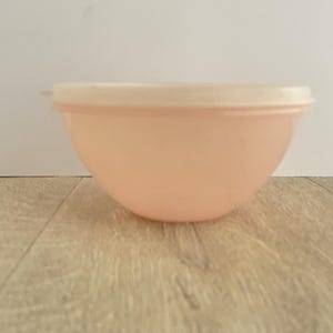 Small peach Tupperware storage  bowl with lid