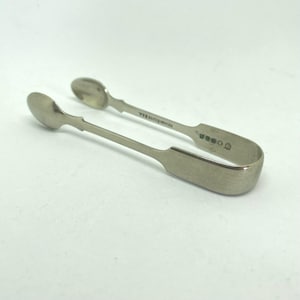 Small plain silver plated sugar tongs