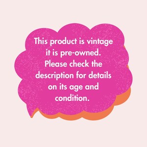 May include: A pink speech bubble with an orange outline contains the text: "This product is vintage, it is pre-owned. Please check the description for details on its age and condition."