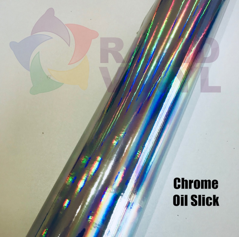 May include: A roll of chrome oil slick vinyl with a holographic iridescent finish. The vinyl has a metallic sheen with blue, green, and purple hues.