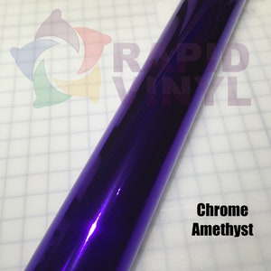 May include: A roll of chrome amethyst vinyl wrap. The vinyl is a deep purple color with a metallic sheen.