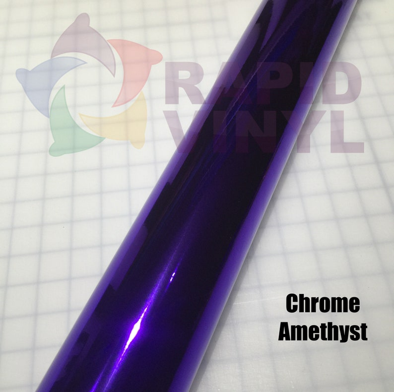 May include: A roll of chrome amethyst vinyl wrap. The vinyl is a deep purple color with a metallic sheen.