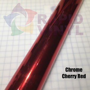 May include: A roll of chrome cherry red vinyl wrap. The vinyl is shiny and reflective.