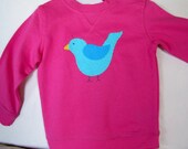 Pink pullover sweatshirt with hand appliqued birdie.