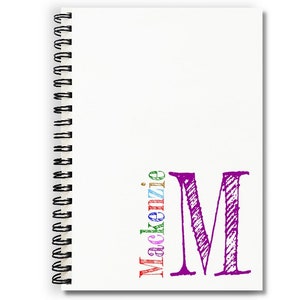 Personalized handmade notebook with white covers and a monogram and name in lower right corner of cover. Choose your monogram initial color. Letters of name are multicolored in blue, green, red, purple, pink and gold.