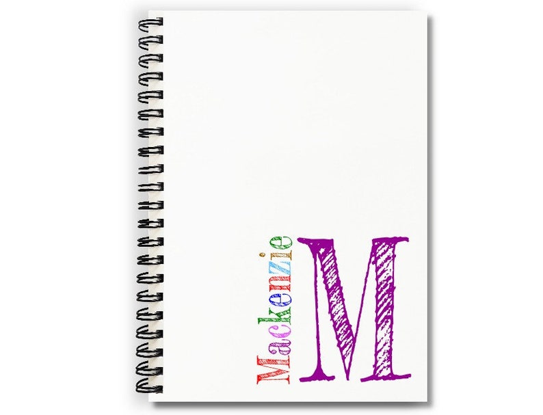 Personalized handmade notebook with white covers and a monogram and name in lower right corner of cover. Choose your monogram initial color. Letters of name are multicolored in blue, green, red, purple, pink and gold.