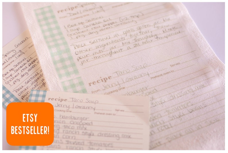 May include: A set of three recipe cards with a blue and white checkered pattern. The cards are made of white fabric and have handwritten recipes for "Taco Soup" and "Spicy Crackers". The cards are labeled "Etsy Bestseller!" in orange.