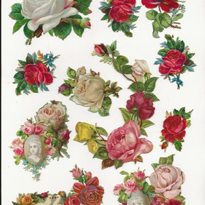 May include: A collection of vintage paper roses in various shades of pink, red, and white. The roses are arranged in bouquets and individual blooms, with some featuring delicate green leaves and stems. The roses are perfect for scrapbooking, card making, or other craft projects.