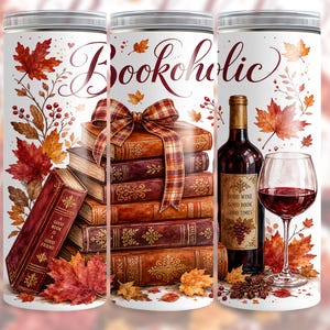 May include: A cylindrical tumbler featuring a white background with a stack of books tied with a plaid ribbon, a wine bottle, and a glass of red wine. The design includes autumn leaves and the text "Bookoholic," "A good book is a good friend," and "Good wine good book good times."