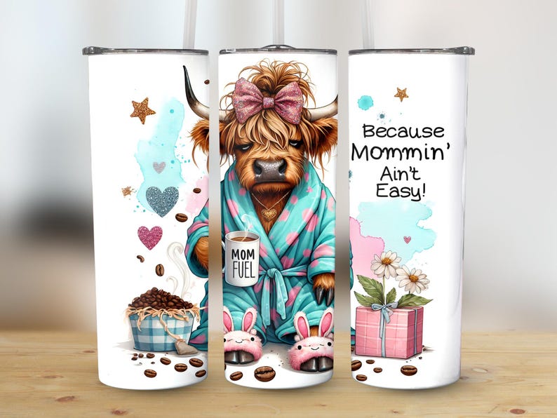 A funny Highland cow in a polka-dot robe, pink bunny slippers, and coquette bow holding a "Mom Fuel" mug, surrounded by coffee beans, glitter hearts, daisies, and a pink gift box. Text reads, "Because Mommin’ Ain’t Easy!" on a playful background.