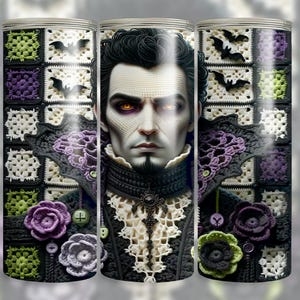 May include: A tumbler featuring a stylized portrait of a vampire with glowing orange eyes. The design incorporates crochet elements, including a collar, floral accents, and a background with bat silhouettes. The color palette includes black, purple, white, and green.