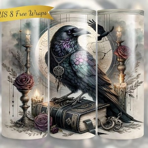 May include: A tumbler featuring a detailed illustration of a black raven perched atop a stack of books. The design includes candles, roses, and a clock face, with the text "BONUS 8 Free Wraps" on a banner.
