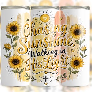 May include: White tumbler with a sunflower design and the text "Chasing Sunshine, Walking in His Light." The design includes yellow sunflowers, green leaves, and a cross. The tumbler is cylindrical and has a silver top and bottom.