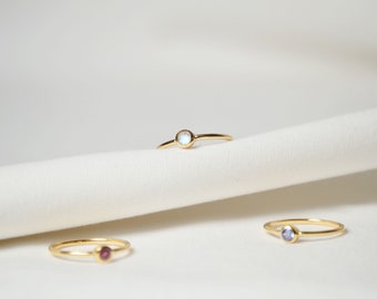 Simple gold ring with gemstone