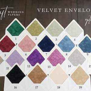 A display of nineteen velvet envelope options in various colors, including green, pink, blue, purple, and brown. Each envelope is numbered and set against a dark wooden background. The text "VELVET ENVELOPE options" is visible.
