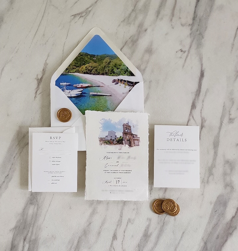 Destination wedding invitation suite with handmade deckle edge invitation, watercolor venue artwork, scenic envelope liner, RSVP and details cards, and gold wax seals.