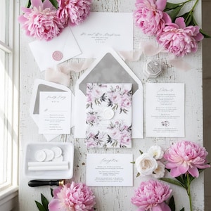 Wedding stationery set featuring a floral invitation with a wax seal, envelopes, and detail cards.