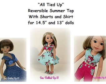 May include: Three dolls wearing a reversible summer top with shorts and skirt. The top is blue with white polka dots and the skirt is blue with white flowers. The shorts are pink with white polka dots. The dolls are 14.5 inches and 13 inches tall. "All Tied Up" Reversible Summer Top With Shorts and Skirt for 14.5" and 13" dolls.