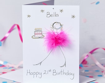 May include: A white card with a pink feather boa and a stick figure holding a cake. The card says "Bella" and "Happy 21st Birthday".