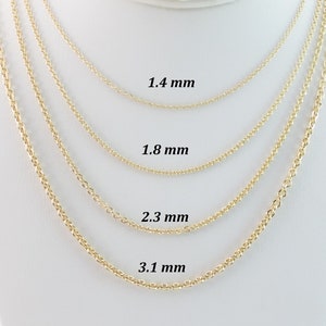 May include: Four gold-colored chain necklaces of varying thicknesses are displayed against a white background. The chains are labeled with their widths: 1.4 mm, 1.8 mm, 2.3 mm, and 3.1 mm. The chains are likely for jewelry making or wearing.