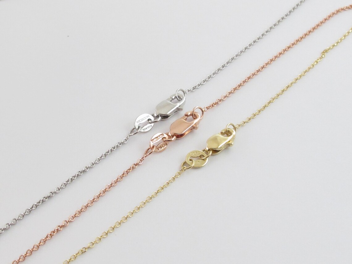 14kt Gold Cross Necklace with .42pts Diamonds CZ7669