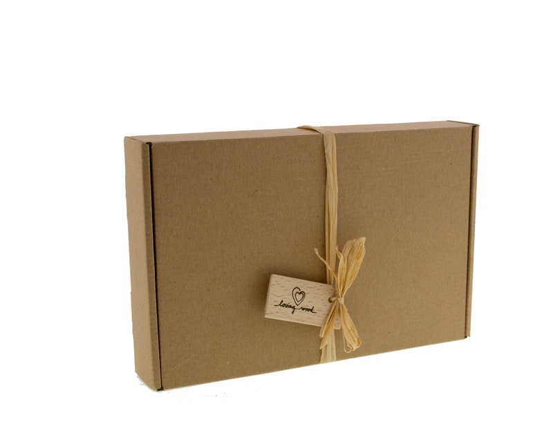 May include: A brown cardboard box with a string bow and a wooden tag that says "loving wood".