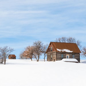 Cabin Atop a Snowy Ridge