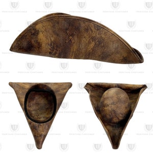 May include: A brown tricorn hat with a distressed leather appearance. The hat features a stitched cross design and is displayed from multiple angles, showcasing its triangular shape and interior.