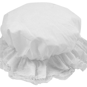 May include: A white fabric bonnet featuring a rounded crown and a gathered, ruffled lace-trimmed brim. The headwear is constructed from a solid white material with a delicate, semi-sheer lace border that encircles the entire edge of the brim.