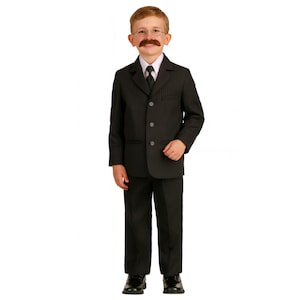 May include: A black pinstriped suit consisting of a single-breasted jacket with three buttons and matching trousers. The ensemble is worn with a white collared shirt, a black necktie, and black dress shoes. The outfit is complete with glasses.