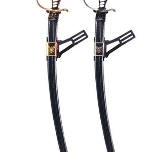 May include: Two ceremonial swords with black scabbards and ornate metal hilts. One sword features a gold-toned hilt and scabbard fitting, while the other has a silver-toned finish. Both scabbards include a black mounting bracket and metal tip.