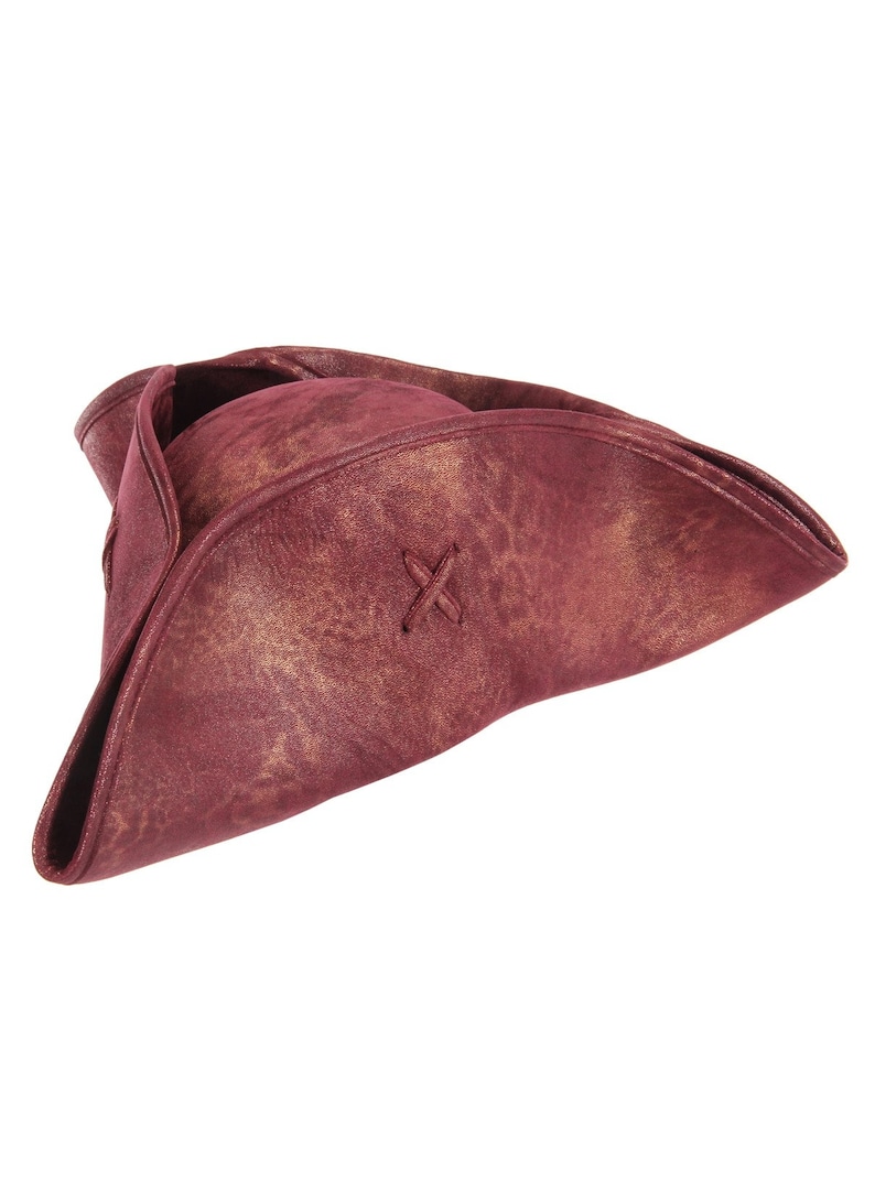 May include: A tricorn hat in a deep burgundy color with a distressed, mottled texture featuring gold-toned highlights. The hat has a wide, upturned brim on three sides and a small, decorative X-shaped stitch detail on the front section of the brim.