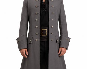 May include: A long grey coat featuring a high collar, long sleeves with decorative buttons at the cuffs, and two vertical rows of metallic buttons down the front. The coat is worn over a black shirt with a lace-up neckline and a black belt.