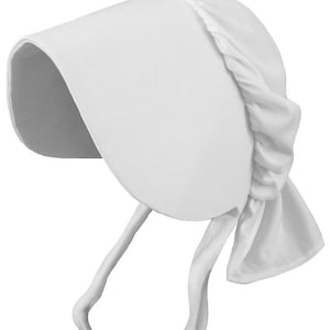 May include: A solid white bonnet featuring a wide, stiffened front brim and a gathered crown section. The headwear includes two long, matching white fabric ties hanging from the sides, designed to secure the bonnet under the chin.