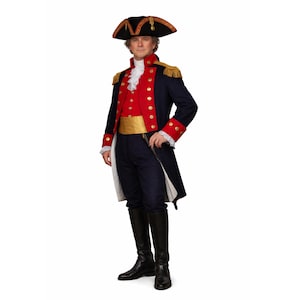 May include: A historical military-style uniform featuring a navy blue coat with red lapels, gold buttons, and gold fringe epaulets. It includes a white ruffled cravat, a gold sash, navy blue trousers, black knee-high boots, and a black bicorne hat.