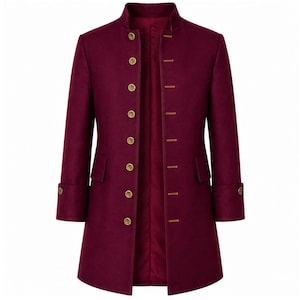 May include: A deep burgundy long coat featuring a high mandarin collar, long sleeves with cuffs, and a front closure with eight gold-toned buttons. The coat includes two flap pockets at the waist and a matching burgundy interior lining.